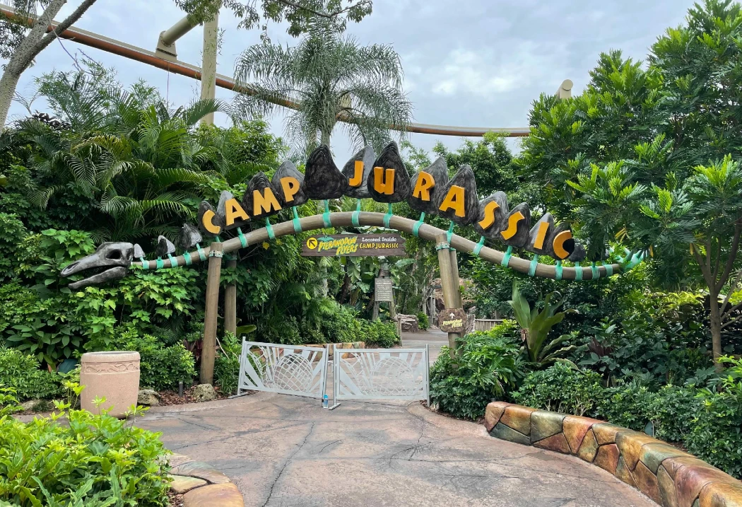 Entrance to Camp Jurassic, with a dinosaur skull sculpture