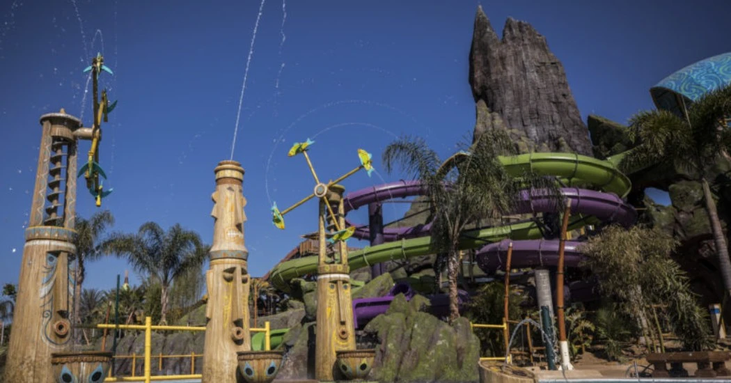 Twisting water slide with a four-foot pool drop