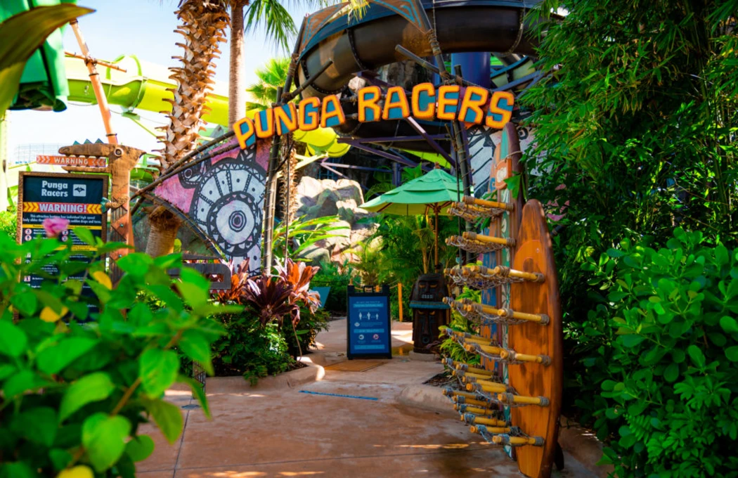 Punga Racers entrance with greenery and colorful sign