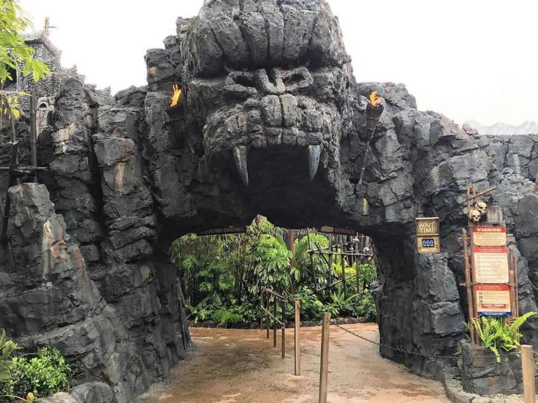 Giant stone monkey head entrance to a themed attraction