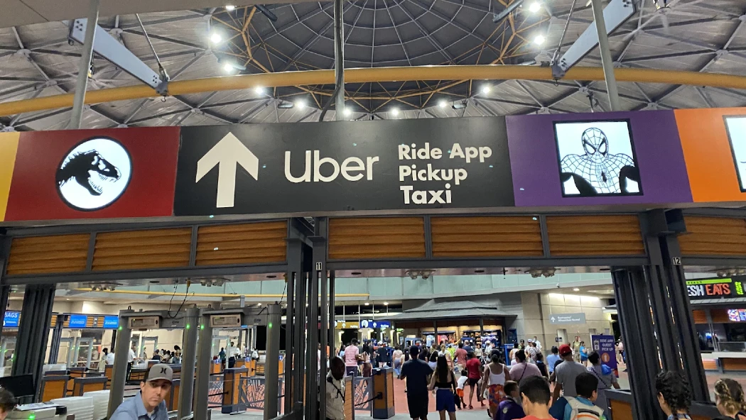 Signage showing directions to Uber and taxi services