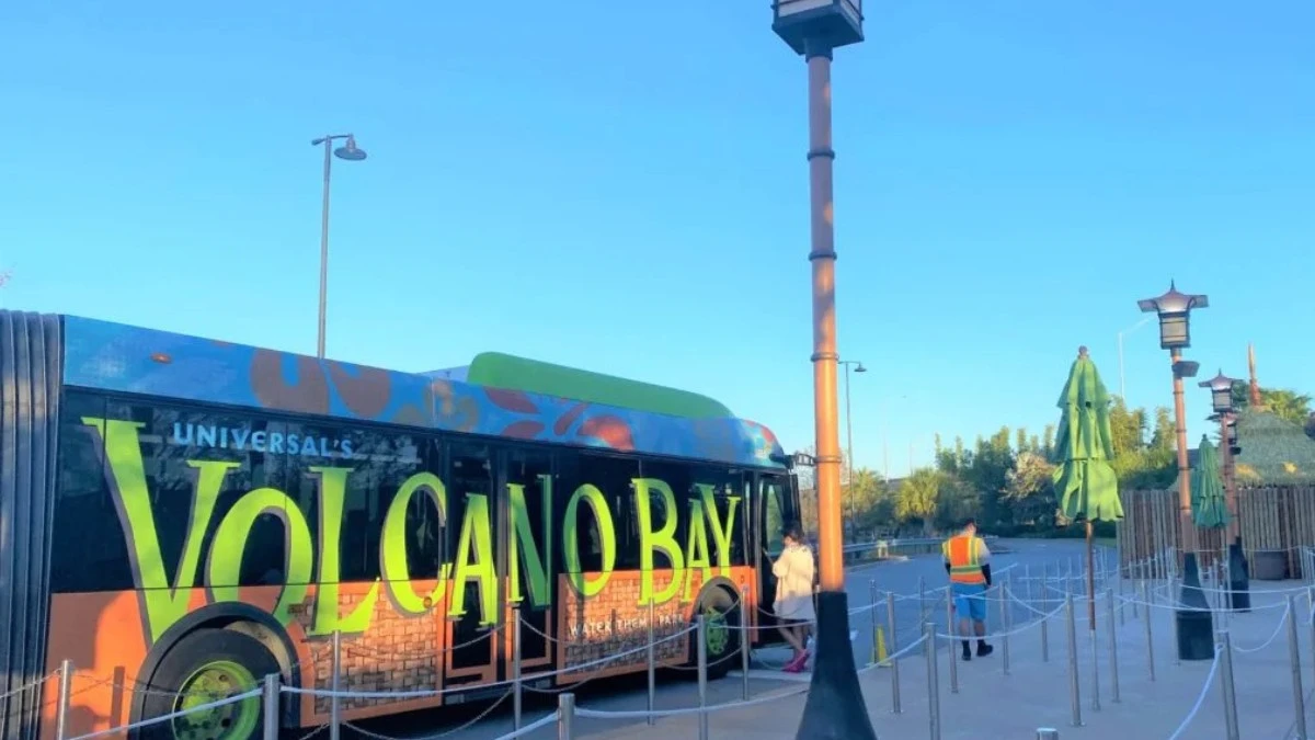 A Volcano Bay shuttle bus is waiting for the riders