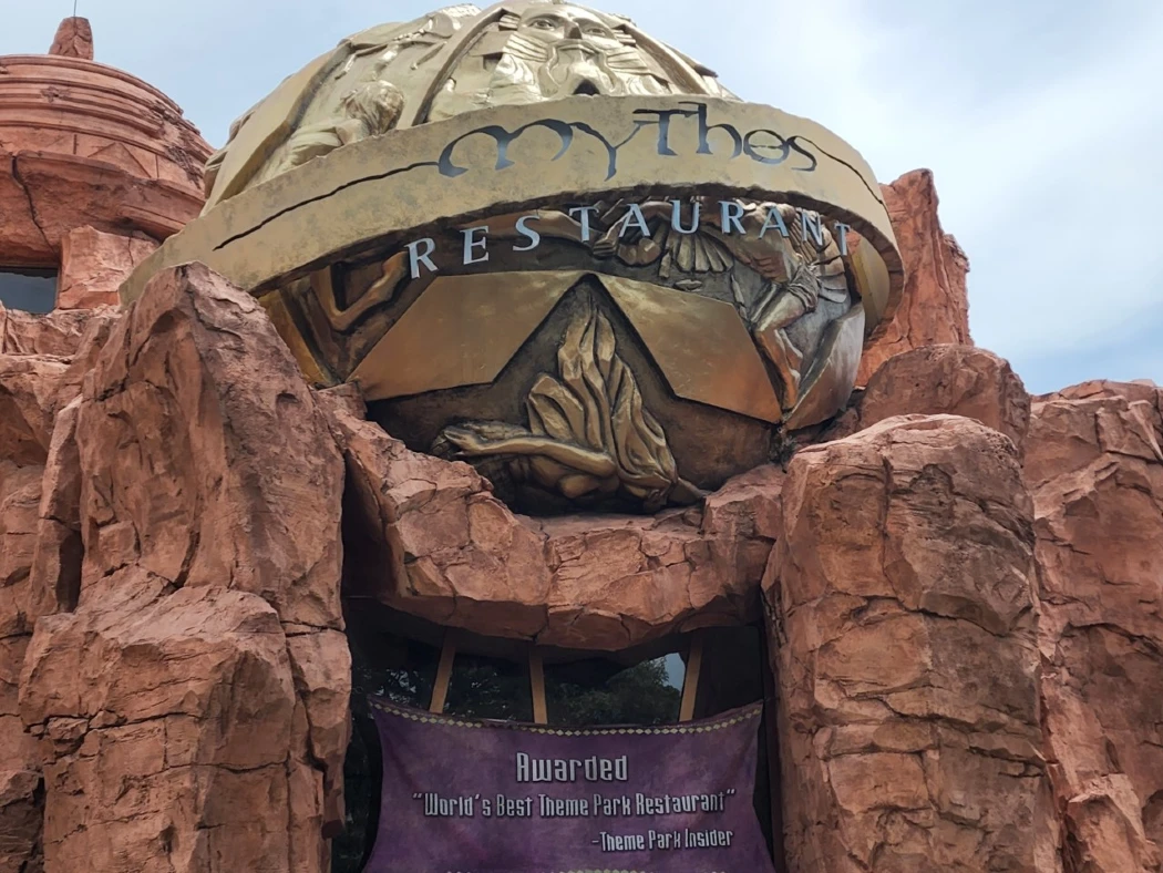 A mountain-style entrance to Mythos Restaurant