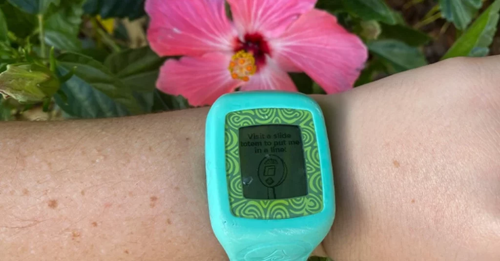A person wearing a blue color TapuTapu wristband